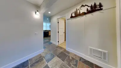 a hallway with a wall with trees on it at Large Spacious Upgraded 4 Bedroom Condo in Mammoth Lakes