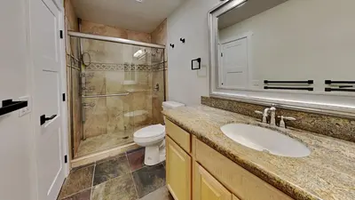 a bathroom with a sink and a shower and a toilet at Large Spacious Upgraded 4 Bedroom Condo in Mammoth Lakes
