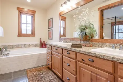 a bathroom with two sinks and a tub and a tub and a tub at Lodges 1140- Spacious Townhome on Golf Course in Old Mammoth