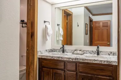 a bathroom with two sinks and a large mirror at Mountainback 15 in Old Mammoth