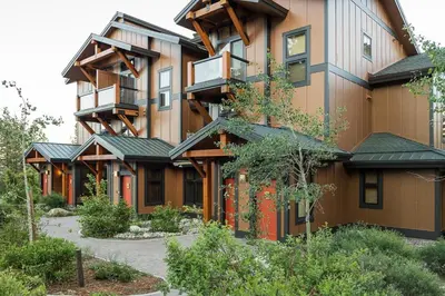 an exterior view of a large house with green roofs at Solstice 21 in Mammoth Lakes
