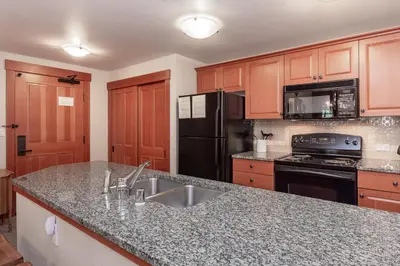 a kitchen with a sink and a counter top at Village 1402 in Mammoth Lakes