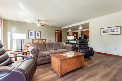 a living room with a couch and a table at Village 3321 in Mammoth Lakes