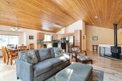 a living room with a couch and a kitchen at North Shore - Golden Pine in Kings Beach