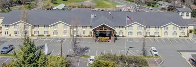 a large building with an american flag in front of it at Murphys Suites in Murphys