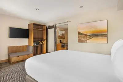 a hotel room with a bed and a flat screen tv at Hilton Vacation Club Tahoe Seasons Lake Tahoe in South Lake Tahoe