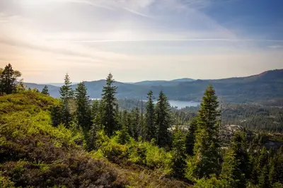 a view from the top of a hill with trees at Snowflower Camping Resort 12 ft. Yurt 9 in Emigrant Gap
