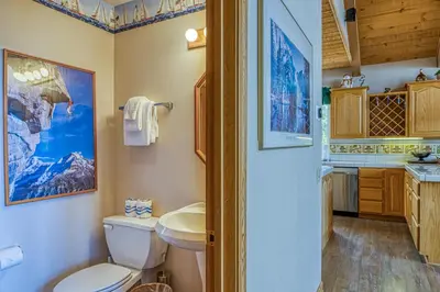 a bathroom with a toilet and a sink at White Pines Mountain Lodge #7 in Mammoth Lakes