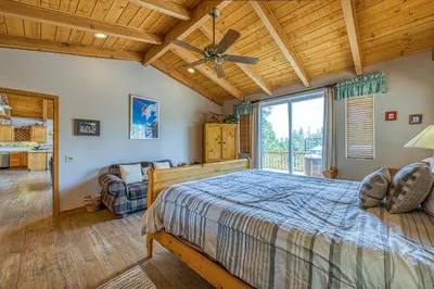 a bedroom with a bed and a large window at White Pines Mountain Lodge #7 in Mammoth Lakes