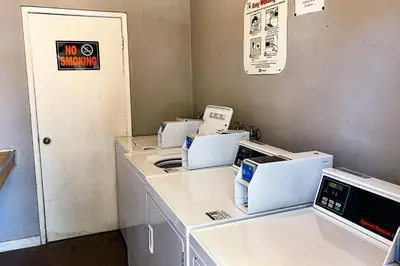 a laundry room with several machines on a counter at Sierra Manors 145 in Mammoth Lakes