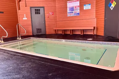 a swimming pool with a bench in a building at The Bridges 203 in Mammoth Lakes