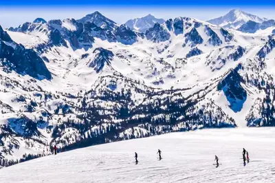 a group of people skiing down a snow covered mountain at Discovery 4 119 in Mammoth Lakes