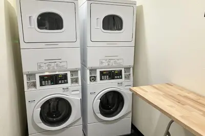three washer and dryer machines in a room at Discovery 4 162 in Mammoth Lakes