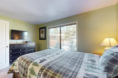 a bedroom with a bed and a window at Discovery 4 162 in Mammoth Lakes