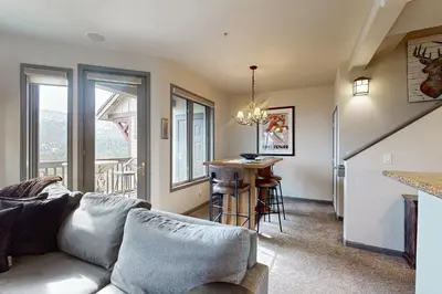 a living room with a couch and a table at Eagle Run 206 in Mammoth Lakes