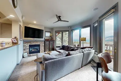 a living room with a couch and a fireplace at Eagle Run 206 in Mammoth Lakes