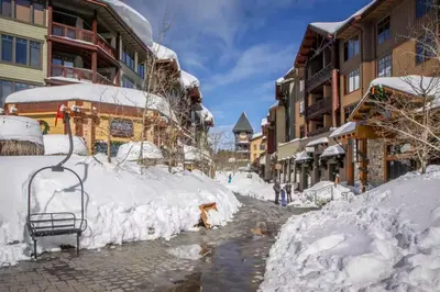 a street covered in snow next to buildings at Forest Creek 22 in Mammoth Lakes