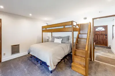 a bedroom with a bunk bed and a staircase at Helios North in Mammoth Lakes