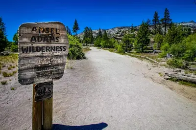 a sign on the side of a dirt road at The Lodges 1145 in Mammoth Lakes