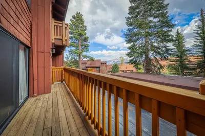 a wooden deck on the side of a building at Mammoth Ski & Racquet 124 in Mammoth Lakes