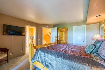 a bedroom with a bed with a blue bedspread at The Bridges 23 in Mammoth Lakes