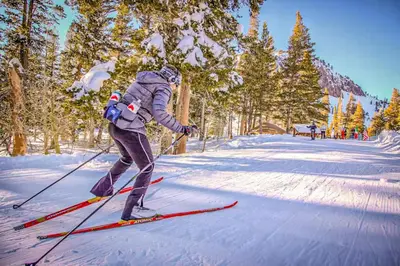 a person is on skis in the snow at The Bridges 23 in Mammoth Lakes