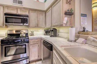 a kitchen with a sink and a stove top oven at Snowcreek 590 in Mammoth Lakes