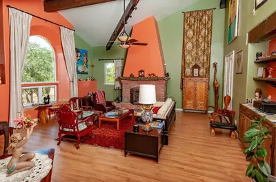 a living room filled with furniture and a fireplace at Posada Mariana Bed and Breakfast in Catheys Valley