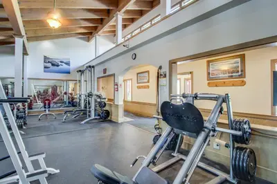 a gym with several treadmills and weights at Great Northstar Condo in Kingswood Estates