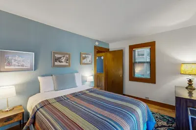 a bedroom with a bed with a colorful blanket at Great Northstar Condo in Kingswood Estates
