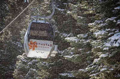 a ski lift in the snow next to some trees at Great Northstar Condo in Kingswood Estates