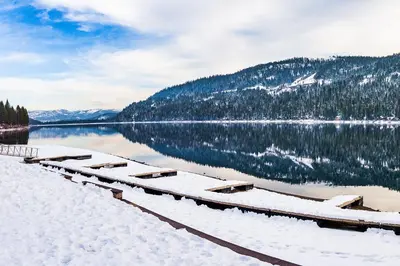 a view of a lake with snow on the ground at Donner Lakefront Retreat in Truckee