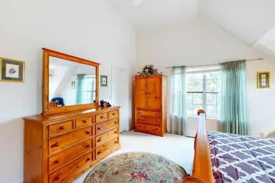 a bedroom with a dresser and a mirror at Great Escape Cabin (08/253) in Groveland