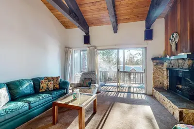 a living room with a couch and a fireplace at Dollar Hill 2 Dreamcatcher in Dollar Point