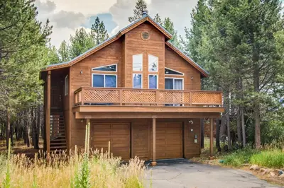 a wooden house with a balcony and a garage at Jade House in Truckee