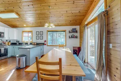 a dining room with a wooden table in a kitchen at Jade House in Truckee