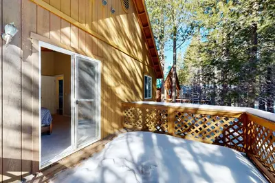 a balcony of a house with a glass door at Jade House in Truckee