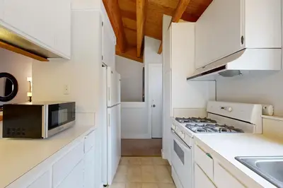a kitchen with white cabinets and a stove top oven at Gold Bend 5034 in Truckee