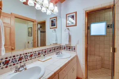 a bathroom with two sinks and a shower at 1225 Gold Bend in Truckee