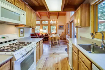 a kitchen with wooden cabinets and a stove top oven at 1225 Gold Bend in Truckee