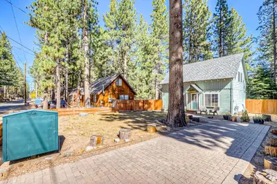 a home in the woods with a tree at Foxglove Terrace in South Lake Tahoe