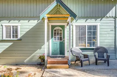 a house with two chairs and a green door at Foxglove Terrace in South Lake Tahoe