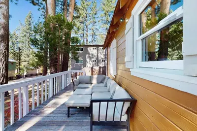 a porch with benches on the side of a house at Cozy Bobby Grey Manor in South Lake Tahoe