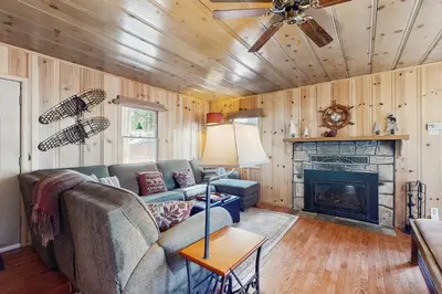 a living room with a couch and a fireplace at Cozy Bobby Grey Manor in South Lake Tahoe
