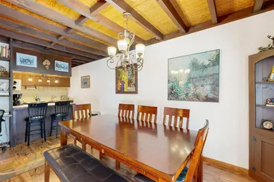 a dining room with a wooden table and chairs at Squaw Valley Views Condo #15 in Olympic Valley