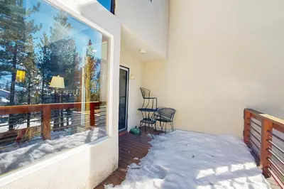 a balcony with snow on the floor and a window at Squaw Valley Views Condo #15 in Olympic Valley
