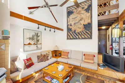a living room with a couch and a tv at Squaw Valley Views Condo #15 in Olympic Valley