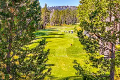 an overhead view of a golf course with trees at Snowpeak Chalet in Tahoe Donner in Truckee