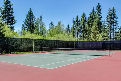 a tennis court with a net on top of it at Carnelian Woods Sanctuary in Carnelian Bay