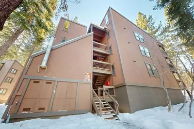 an exterior view of a building in the snow at Aspen Grove Hideaway in Truckee
